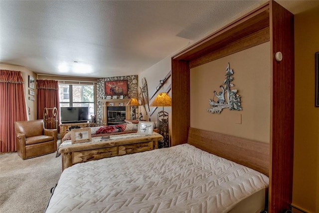 100 S Park Ave Unit E113, Breckenridge, CO 80424 - carpeted bedroom featuring a glass covered fireplace