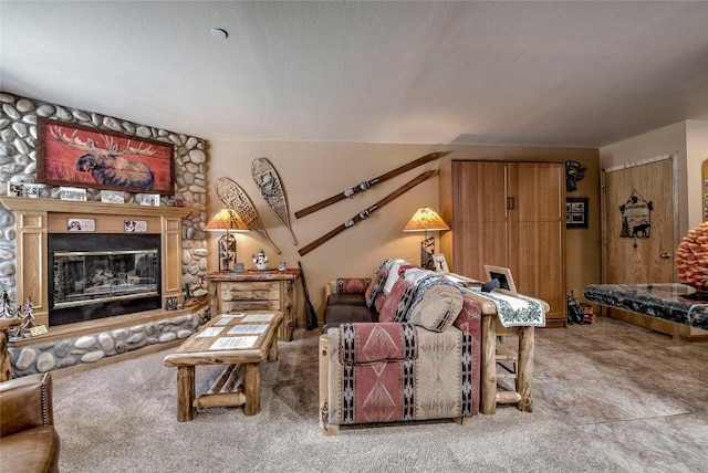 100 S Park Ave Unit E113, Breckenridge, CO 80424 - living area with carpet, a stone fireplace, and a textured ceiling