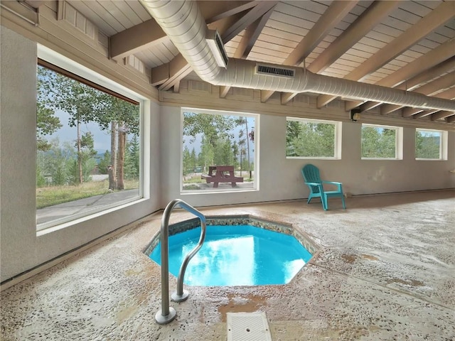 view of swimming pool with a patio area