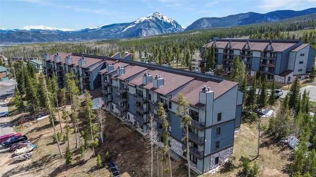 89200 Ryan Gulch Rd Unit 208, Silverthorne, CO 80498 - drone / aerial view of a mountainous background and apartment complex / building