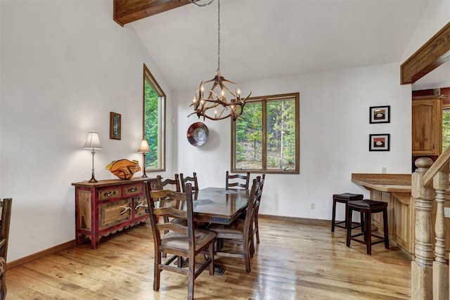 322 Davis Ct, Breckenridge, CO 80424 - dining space featuring light wood finished floors and a chandelier