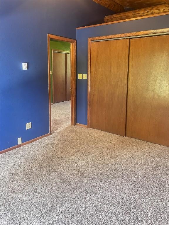 33000 Maricopa Trl, Oak Creek, CO 80467 - unfurnished bedroom with carpet, lofted ceiling, and a closet