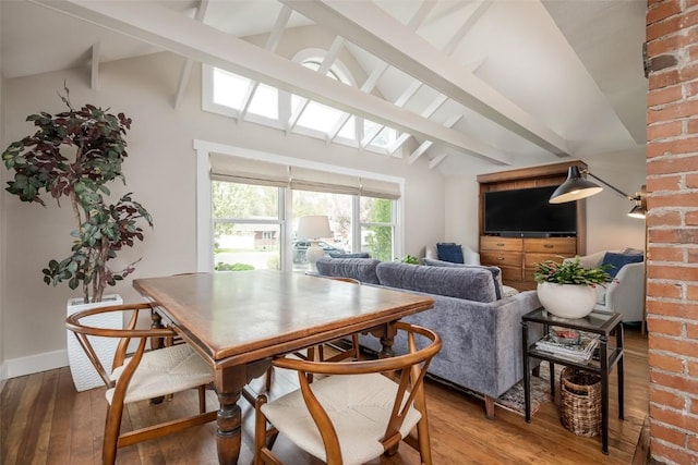464 8th St, Steamboat Springs, CO 80487 - dining room featuring light wood-style floors, a skylight, and baseboards