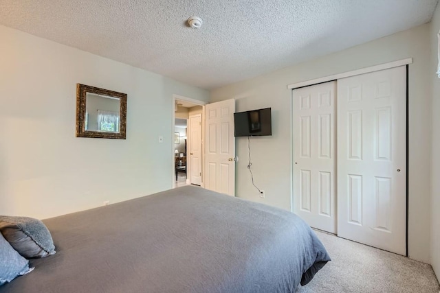 412 S Main St Unit 215, Breckenridge, CO 80424 - carpeted bedroom with a textured ceiling and a closet