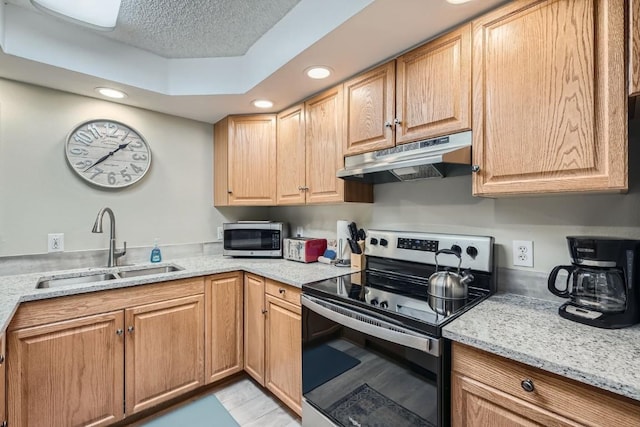 412 S Main St Unit 215, Breckenridge, CO 80424 - kitchen featuring recessed lighting, under cabinet range hood, stainless steel appliances, and a sink