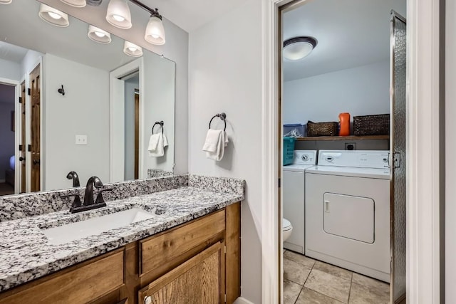 325 Four Oclock Rd Unit E202, Breckenridge, CO 80424 - bathroom with vanity, separate washer and dryer, and tile patterned floors