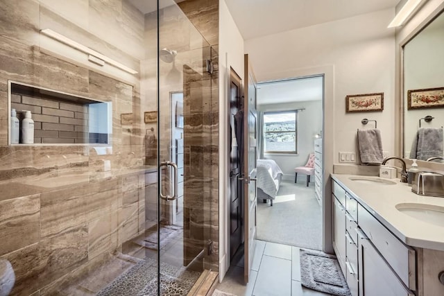 1090 Blue River Pkwy Unit 204, Silverthorne, CO 80498 - ensuite bathroom with double vanity, a shower stall, and tile patterned floors