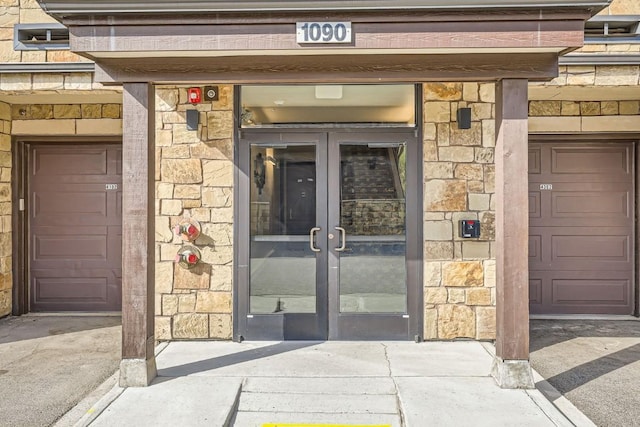 1090 Blue River Pkwy Unit 204, Silverthorne, CO 80498 - view of exterior entry featuring stone siding and french doors