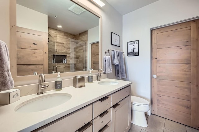 1090 Blue River Pkwy Unit 204, Silverthorne, CO 80498 - bathroom with toilet, double vanity, a stall shower, and tile patterned flooring