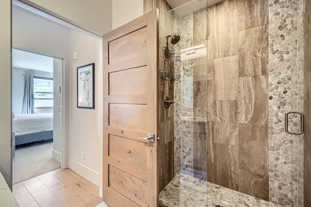 1090 Blue River Pkwy Unit 204, Silverthorne, CO 80498 - bathroom with a shower stall, ensuite bathroom, and baseboards