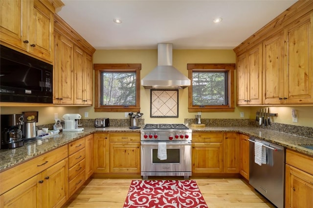 2760 Burgess Creek Rd Unit 2, Steamboat Springs, CO 80487 - kitchen featuring island exhaust hood, stone countertops, stainless steel appliances, and plenty of natural light