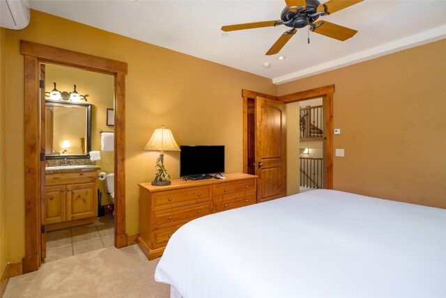 2760 Burgess Creek Rd Unit 2, Steamboat Springs, CO 80487 - bedroom featuring connected bathroom, ceiling fan, light carpet, a wall unit AC, and recessed lighting