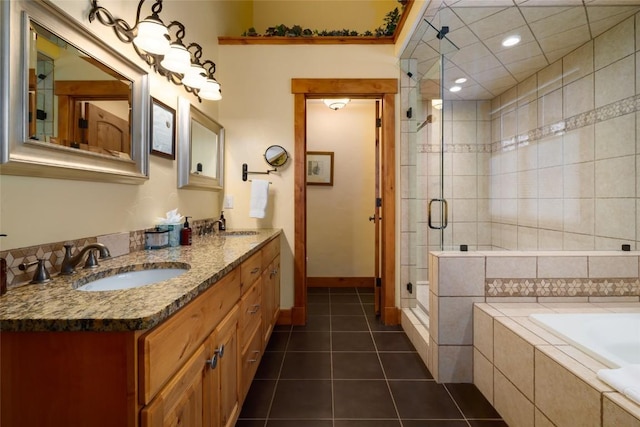 2760 Burgess Creek Rd Unit 2, Steamboat Springs, CO 80487 - bathroom featuring a shower stall, a sink, a bath, double vanity, and tile patterned flooring