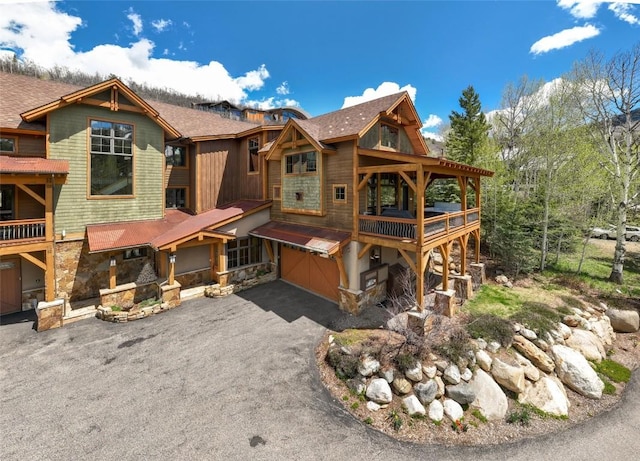 2760 Burgess Creek Rd Unit 2, Steamboat Springs, CO 80487 - back of property with a garage and driveway