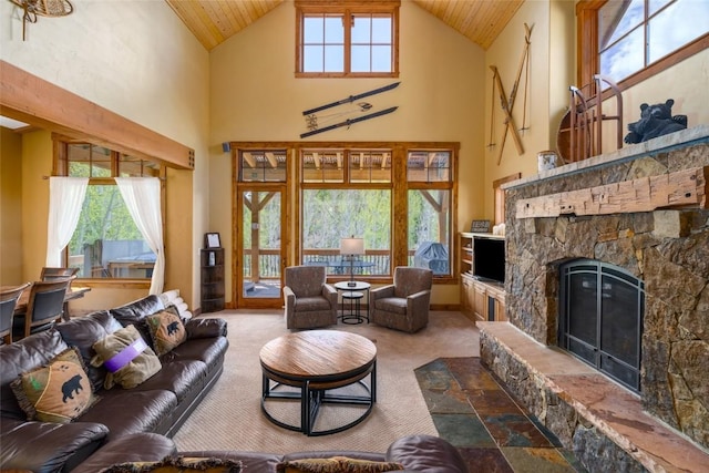 2760 Burgess Creek Rd Unit 2, Steamboat Springs, CO 80487 - carpeted living area with high vaulted ceiling, wood ceiling, and a fireplace
