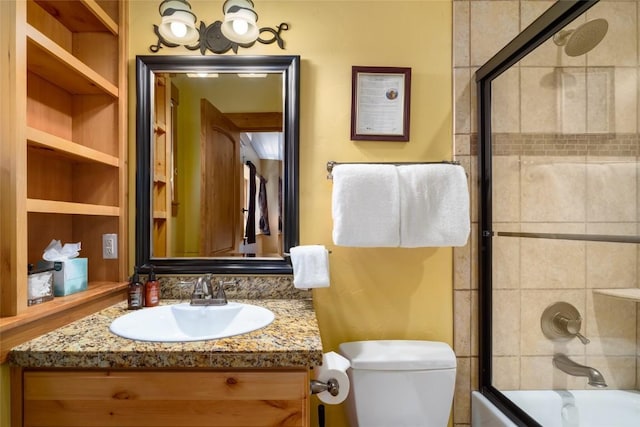 2760 Burgess Creek Rd Unit 2, Steamboat Springs, CO 80487 - bathroom with toilet, vanity, and combined bath / shower with glass door