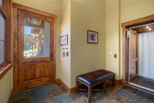 2760 Burgess Creek Rd Unit 2, Steamboat Springs, CO 80487 - foyer featuring stone tile flooring and baseboards