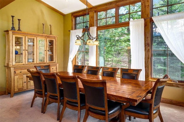 2760 Burgess Creek Rd Unit 2, Steamboat Springs, CO 80487 - dining space featuring light carpet, baseboards, and plenty of natural light