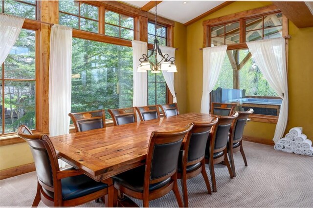 2760 Burgess Creek Rd Unit 2, Steamboat Springs, CO 80487 - dining area featuring lofted ceiling, light carpet, and baseboards