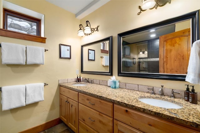 2760 Burgess Creek Rd Unit 2, Steamboat Springs, CO 80487 - full bath with baseboards, tile patterned floors, a sink, and double vanity
