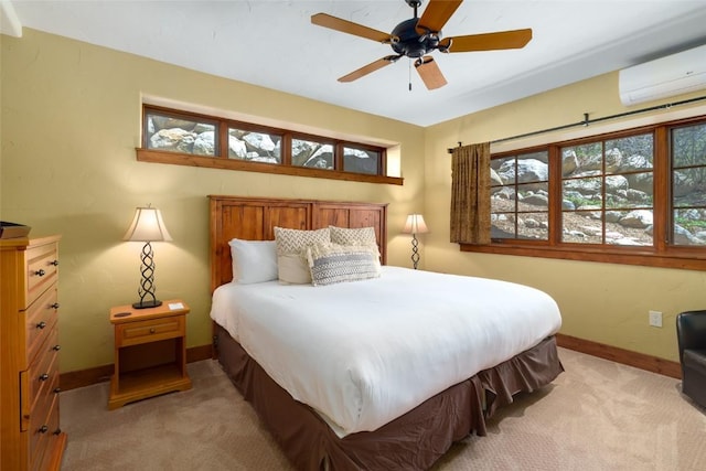 2760 Burgess Creek Rd Unit 2, Steamboat Springs, CO 80487 - bedroom featuring light colored carpet, ceiling fan, baseboards, and a wall mounted AC
