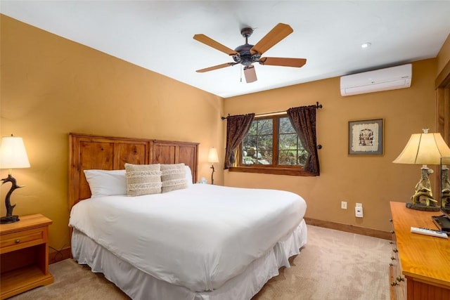 2760 Burgess Creek Rd Unit 2, Steamboat Springs, CO 80487 - bedroom with baseboards, light colored carpet, a wall unit AC, and ceiling fan