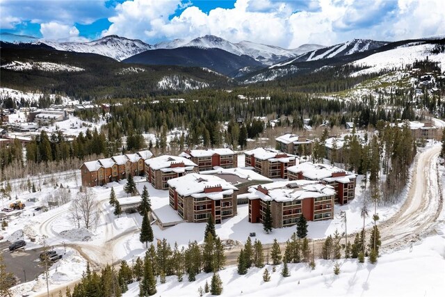 490 Kings Crossing Rd Unit 321, Winter Park, CO 80482 - snowy aerial view featuring a mountain view