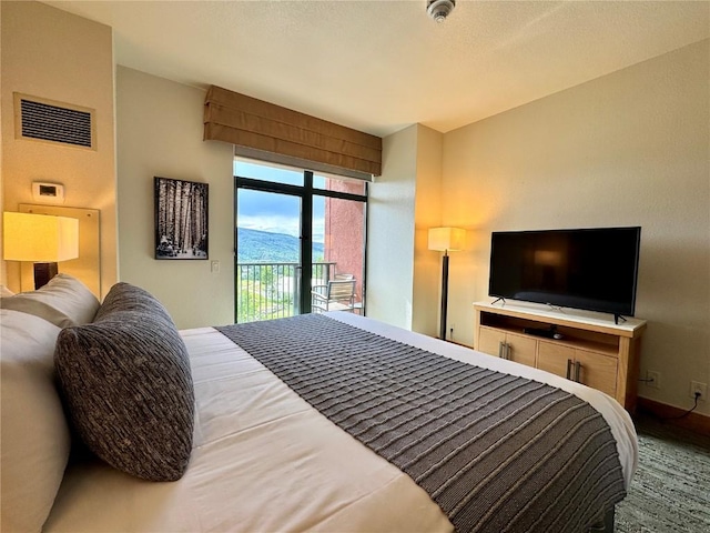 2300 Mount Werner Cir Unit 631, Steamboat Springs, CO 80487 - bedroom featuring access to outside and baseboards