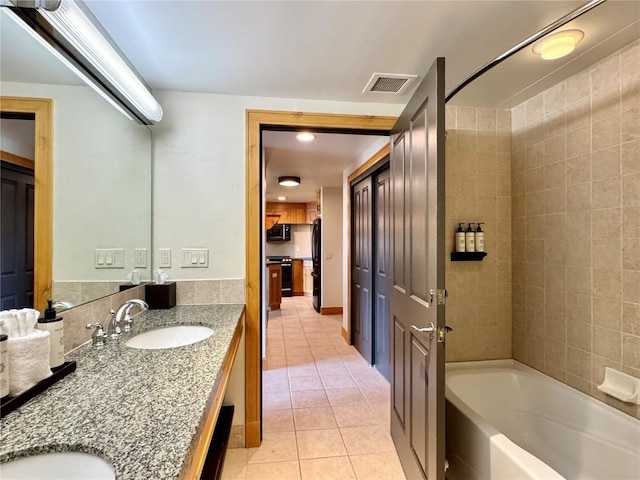 2300 Mount Werner Cir Unit 631, Steamboat Springs, CO 80487 - full bathroom featuring tile patterned flooring, double vanity, and shower / bathtub combination