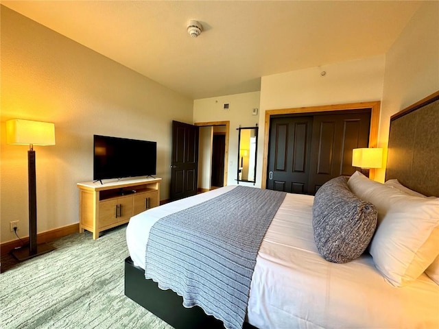 2300 Mount Werner Cir Unit 631, Steamboat Springs, CO 80487 - bedroom featuring baseboards and multiple closets
