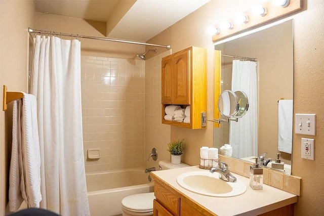 full bath with toilet, vanity, and shower / tub combo