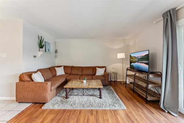 753 Straight Creek Dr Unit 304, Dillon, CO 80435 - living room featuring light wood-style flooring and baseboards