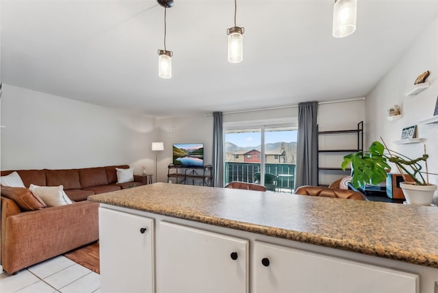 753 Straight Creek Dr Unit 304, Dillon, CO 80435 - kitchen featuring open floor plan, white cabinetry, and pendant lighting