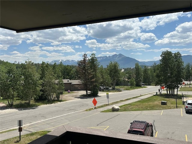0893 Straight Creek Dr Unit 302, Dillon, CO 80435 - view of asphalt road featuring traffic signs and a mountain view