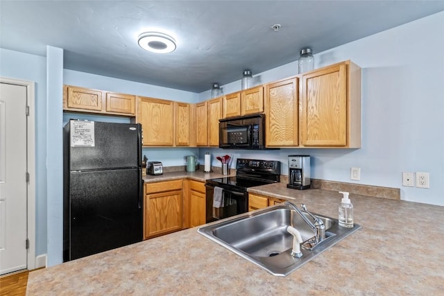 2545 Cattle Kate Cir Unit 3207, Steamboat Springs, CO 80487 - kitchen featuring black appliances, a sink, and light countertops