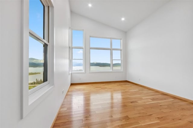 100 Gcr 4104, Granby, CO 80446 - empty room with light wood-style flooring, lofted ceiling, and recessed lighting