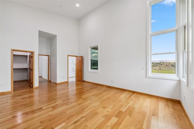 100 Gcr 4104, Granby, CO 80446 - unfurnished bedroom with light wood-style floors, a high ceiling, and a spacious closet