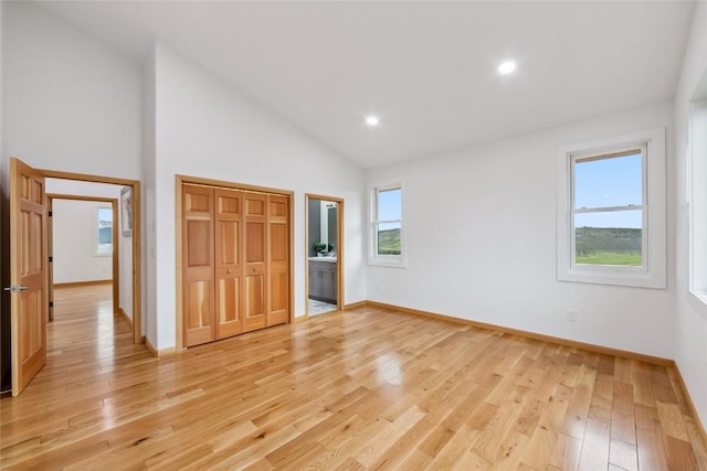 100 Gcr 4104, Granby, CO 80446 - unfurnished bedroom with multiple windows, light wood-style floors, high vaulted ceiling, recessed lighting, and a closet