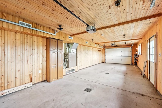 100 Gcr 4104, Granby, CO 80446 - garage featuring a garage door opener and wood walls