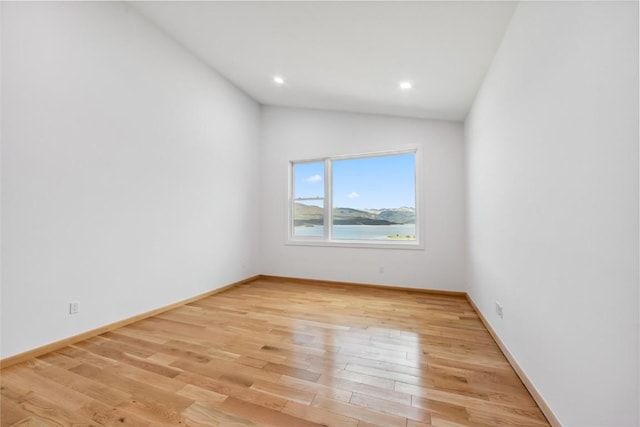 100 Gcr 4104, Granby, CO 80446 - empty room with lofted ceiling, light wood-style floors, and recessed lighting