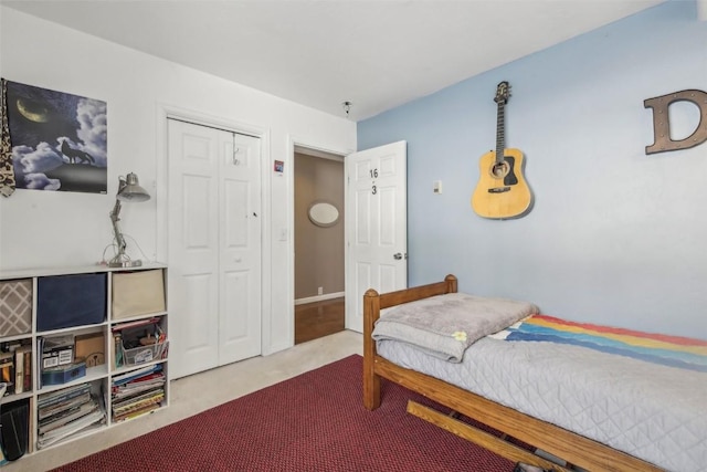 carpeted bedroom featuring a closet