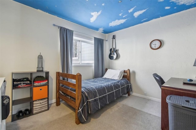 bedroom featuring carpet flooring and baseboards