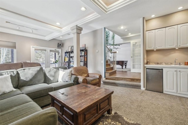living room with wet bar, carpet, recessed lighting, ornate columns, and stairway