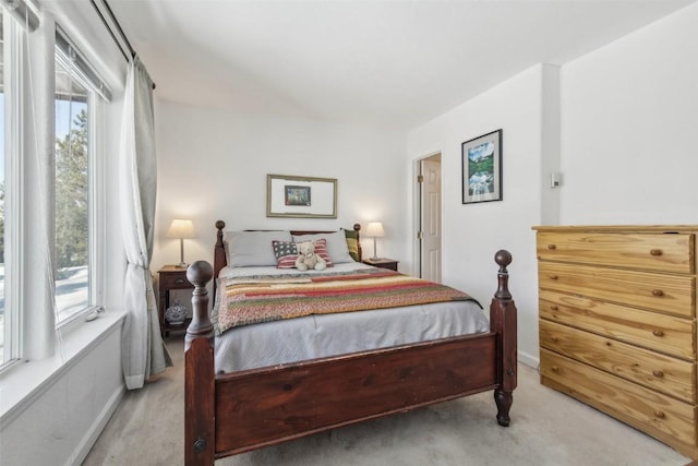 carpeted bedroom with baseboards