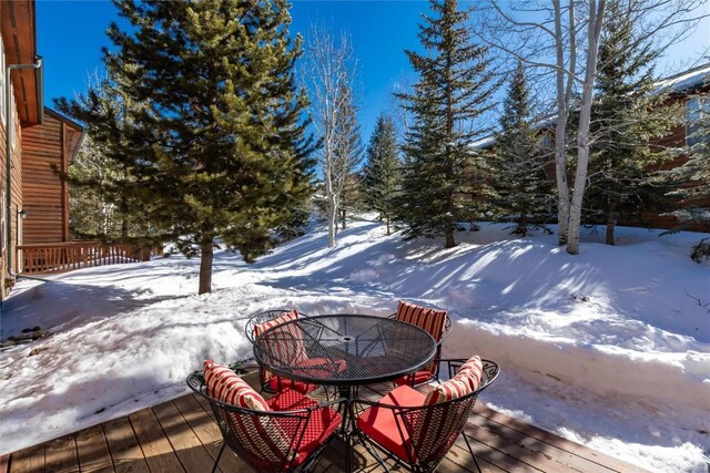 98 Lookout Ridge Dr Unit 98, Dillon, CO 80435 - snow covered deck featuring outdoor dining area