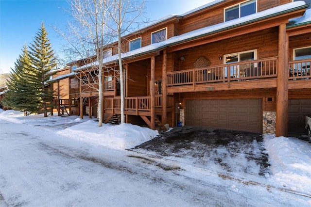98 Lookout Ridge Dr Unit 98, Dillon, CO 80435 - view of front of home with a garage and stone siding