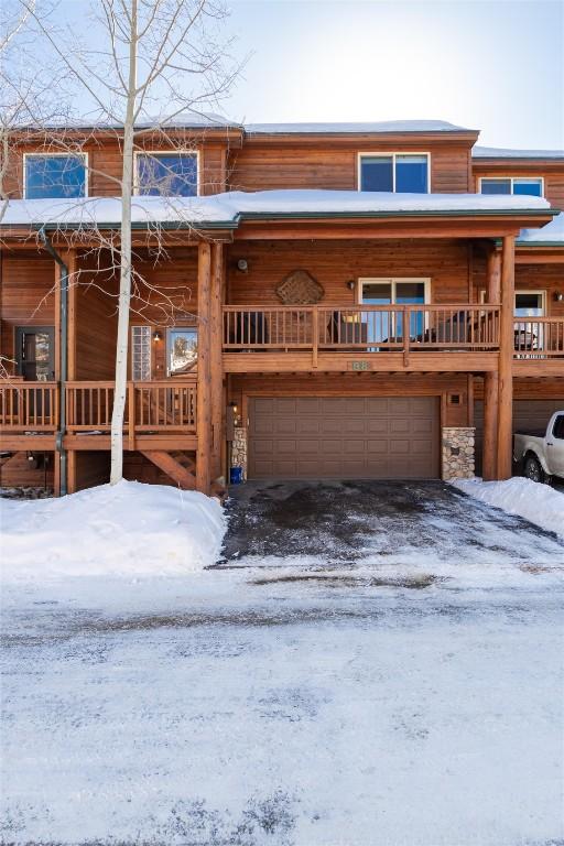 98 Lookout Ridge Dr Unit 98, Dillon, CO 80435 - view of front of home with an attached garage and stone siding