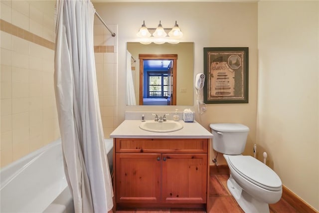 bathroom featuring baseboards, vanity, toilet, and shower / bathtub combination with curtain