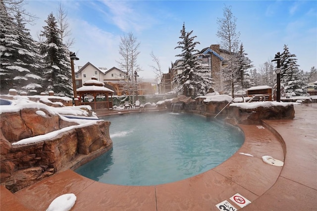 view of swimming pool featuring a fenced in pool, fence, and a gazebo