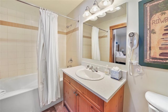 full bathroom with shower / bath combo, connected bathroom, vanity, and toilet